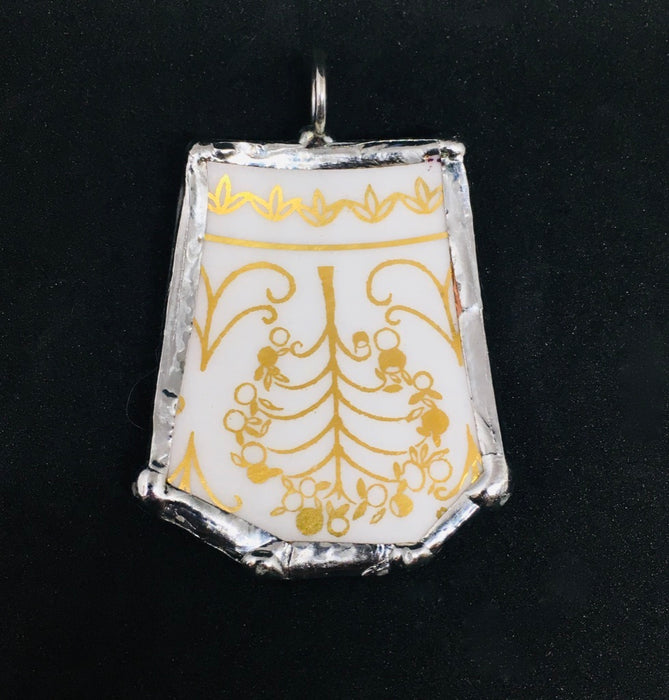 Gold lines on white pendant
